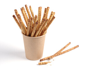 Bread sticks in a paper glass