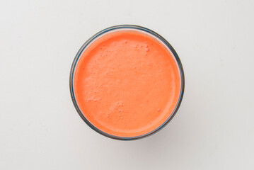 Isolated citrus juice. One glass with orange, grapefruit or lemon juice isolated on white background.