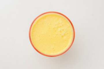 Isolated citrus juice. One glass with orange, grapefruit or lemon juice isolated on white background.