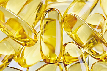 Fish oil concentrate in a soft gelatin capsule to support human health. Omega3 close-up on a white background.