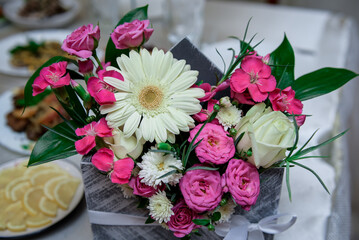 Composition of flowers on the table. Festive table decoration