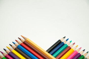 colored pencils on a white background. education concept. illustration of training.