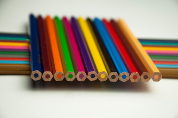colored pencils on a white background. education concept. illustration of training.