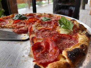 pizza with cheese and salami close-up