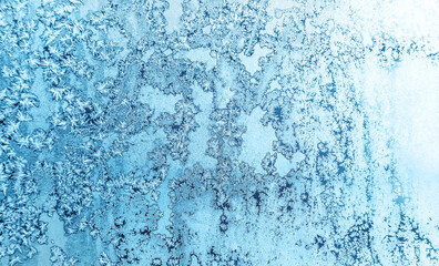 Frost patterns on the window. Texture. Selective focus.