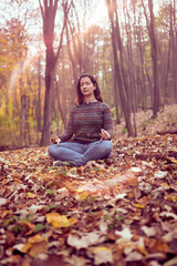Woman meditationg in forest, Connected with Nature, Breathing ,Peace and Freedom concept