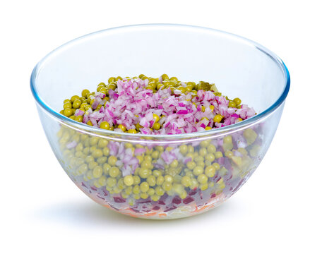Glass bowl with chopped vegetables salad on white background isolation