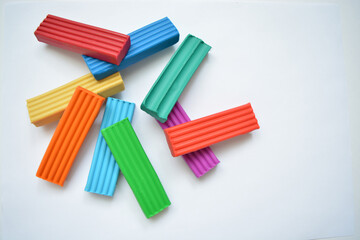 Clay pieces isolated on a white background. Close-up. Plasticine isolated on white background.