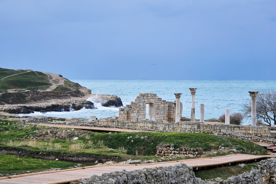 ruins of antique greek basilica with columns on the seashore in Chersonesos