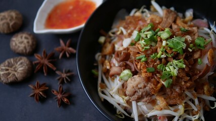 Rice flat noodle with dried shrimp,  ground pork, squid, tofu and beansprout in sweet black soy sauce, Thai called Kuay Teow Lord