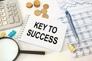 Business concept - notebook writing Key to success