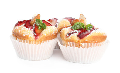 Delicious cupcakes with plums isolated on white