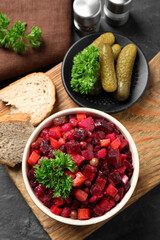 Traditional Russian salad vinaigrette served on grey table, flat lay