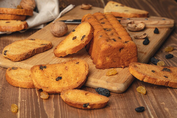 Delicious sweet bread roll on wooden background
