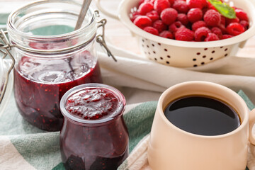 Composition with sweet raspberry jam on table