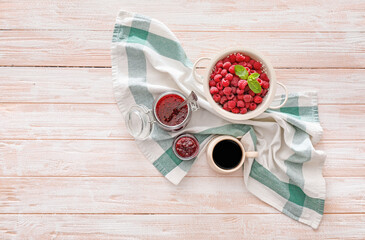 Composition with sweet raspberry jam on wooden background