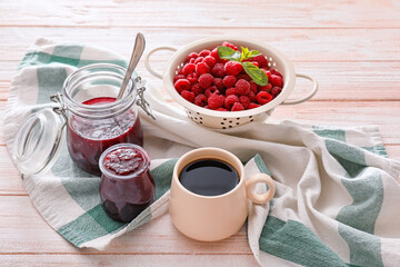Composition with sweet raspberry jam on wooden background