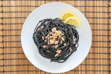Squid ink pasta with salmon and lemon sauce