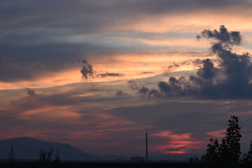 Sunset turns cloudy sky red