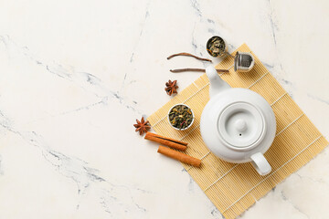 Composition with dry green tea on light background