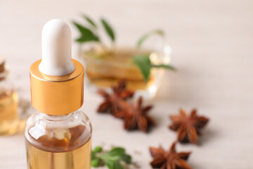 Bottle of anise essential oil, closeup. Space for text