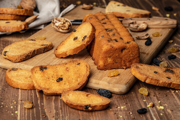 Delicious sweet bread roll on wooden background