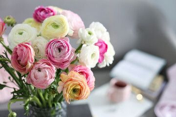 Bouquet of beautiful ranunculuses in living room