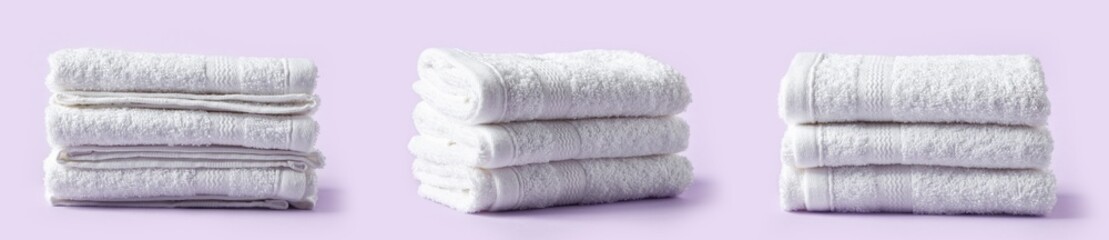 White spa towels on purple background