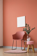 Chair and table near color wall in room