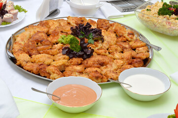 Chicken nuggets on a white plate