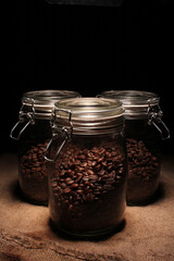 variety of roasted arabica and robusta coffee beans from Indonesia, kept in a tight sealed glass jar