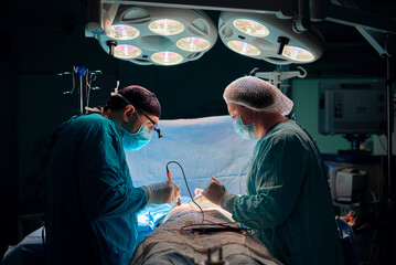 surgeon performs the operation in the operating room