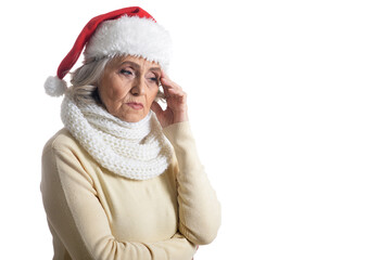 Portrait of sad senior woman in Santa hat