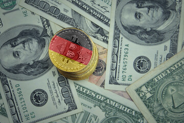 golden shining bitcoins with flag of germany on a dollar money background.