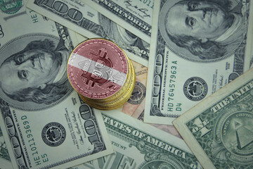 golden shining bitcoins with flag of latvia on a dollar money background.