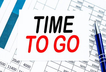 Text TIME TO GO on financial tables, the working paper . Business and financial conzept.