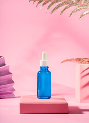Hyaluronic acid serum generic bottle treatment on pink geometric background with shadows - 413512747