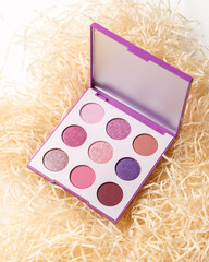 MUA and girly concept. Eyeshadow palette, eye shadows cosmetics product as luxury beauty brand promotion. Fashion blog design. Contouring palette. Makeup palette close up. Colorful, bright colors