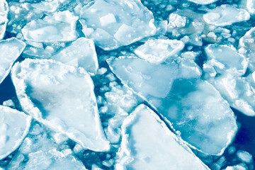 big frozen pieces of ice in the sea, top view