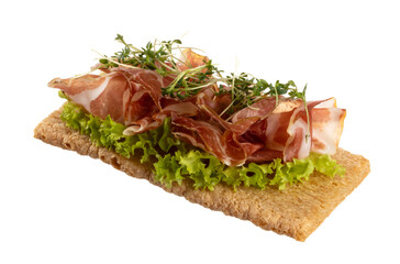 Variety of mini sandwiches with cream cheese, vegetables and salami.