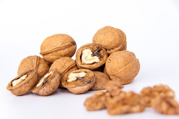 Walnuts in a shell on a white background. Healthy nuts.