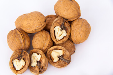 Walnuts in a shell on a white background. Healthy nuts.