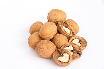 Walnuts in a shell on a white background. Healthy nuts.