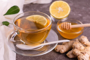 Healthy tea with ginger, lemon and honey.
Close-up.
