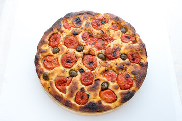 Focaccia typical of Bari Italy with tomatoes and olive