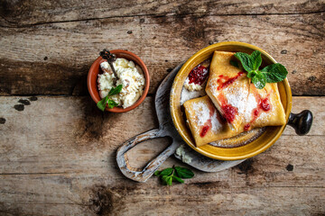 Crepes with ricotta cheese and currant jam. Delicious crepes, Thin pancakes, blini. Sweet dessert....