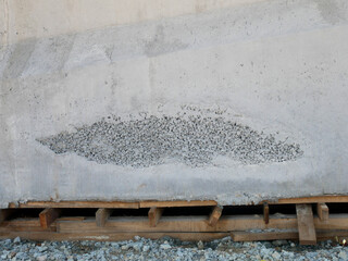 New fresh concrete surface with honeycomb problem and might expose reinforcement bar inside. The...