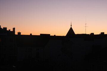 roofs of the city at sunset