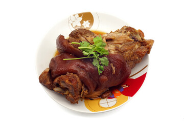 Traditional Bavarian schweinshaxe with coleslaw and preztel