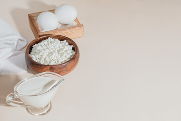 Food is a source of calcium magnesium, protein, fats, carbohydrates, balanced diet. Dairy products on the table: cottage cheese sour cream milk chicken egg contain casein albumin globulin free lactose